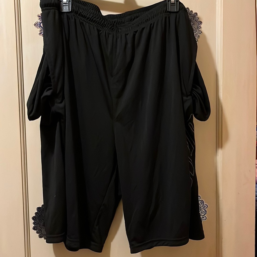 Gently loved men black Puma athletic shorts. Size XXL smoke free